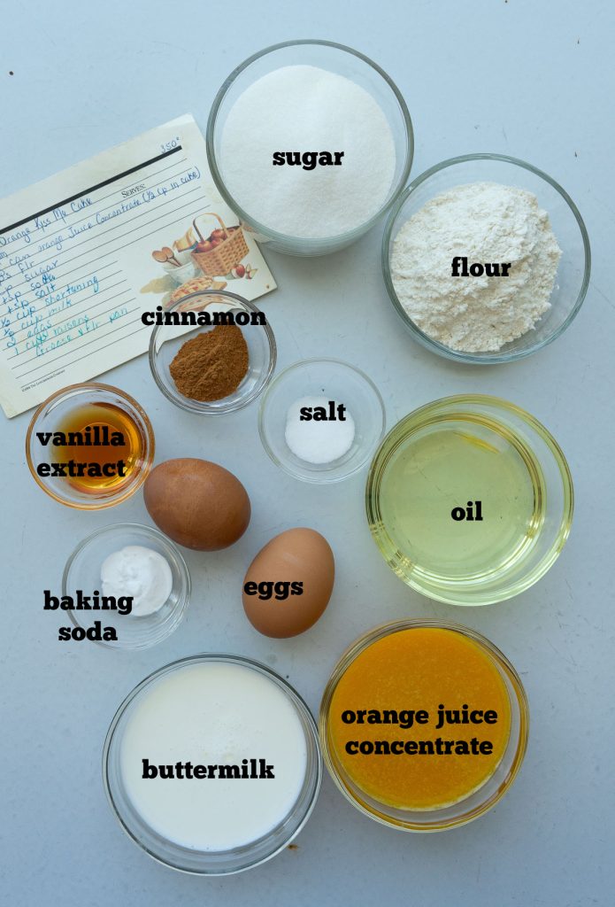 orange muffin ingredients on a gray back ground