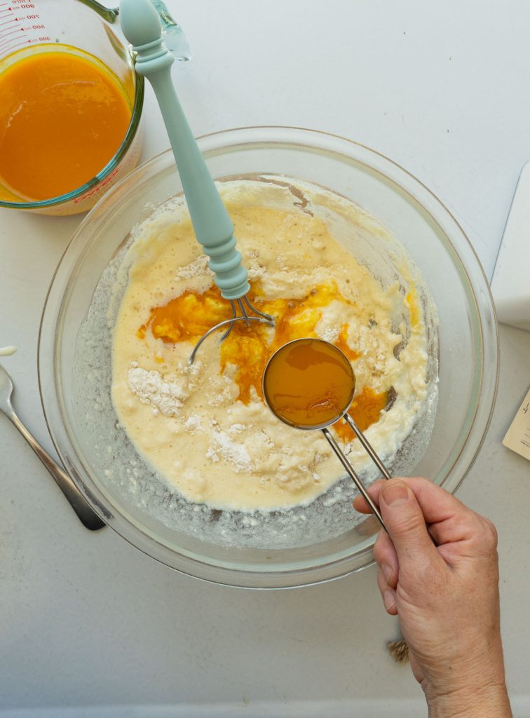 adding orange juice reduction to the muffin batter
