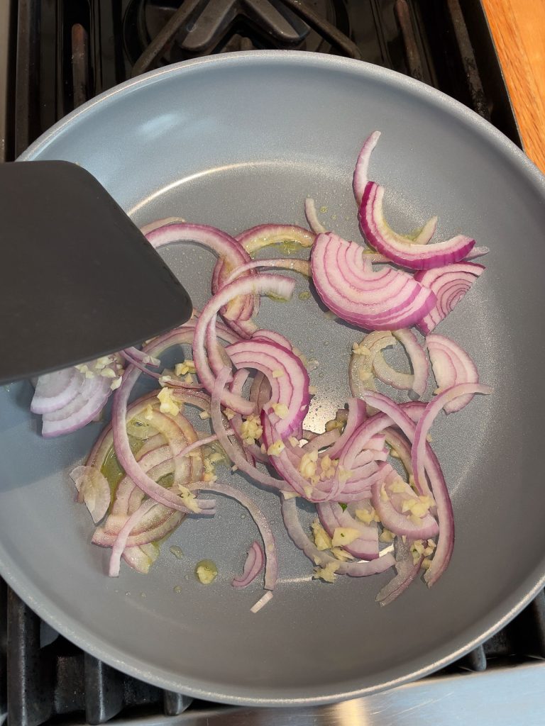 olive oil, garlic, and red onion in a skillet 