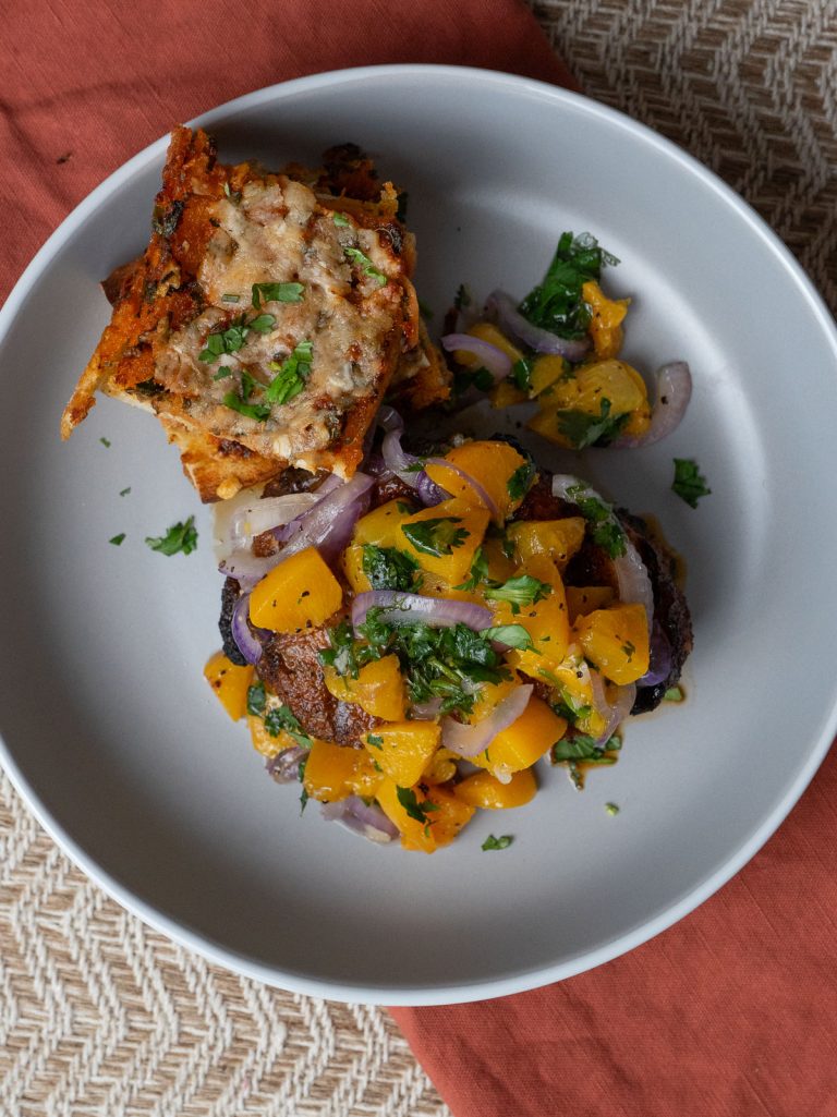 barbecue grilled pork chops with peach salsa and cilantro chili garlic bread