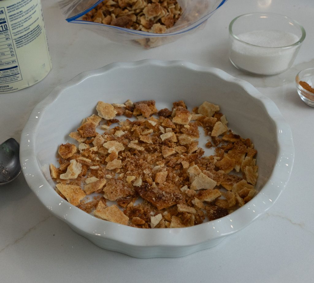 bottom of pie plate covered with churro crisps