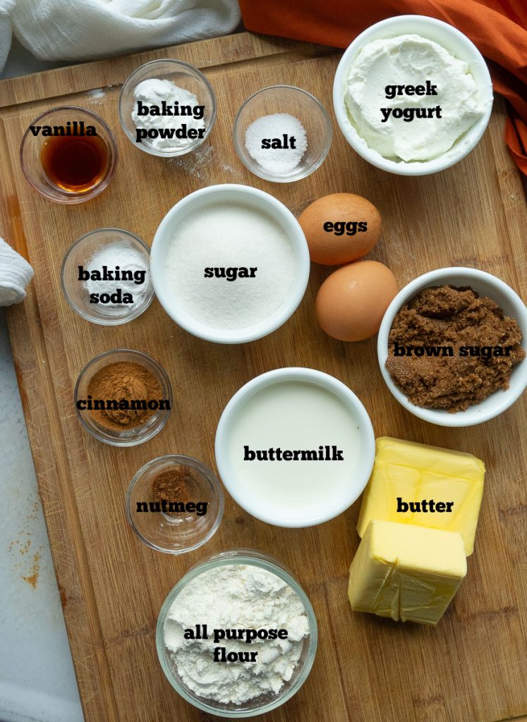 ingredients for cinnamon streusel bread on a wood cutting board