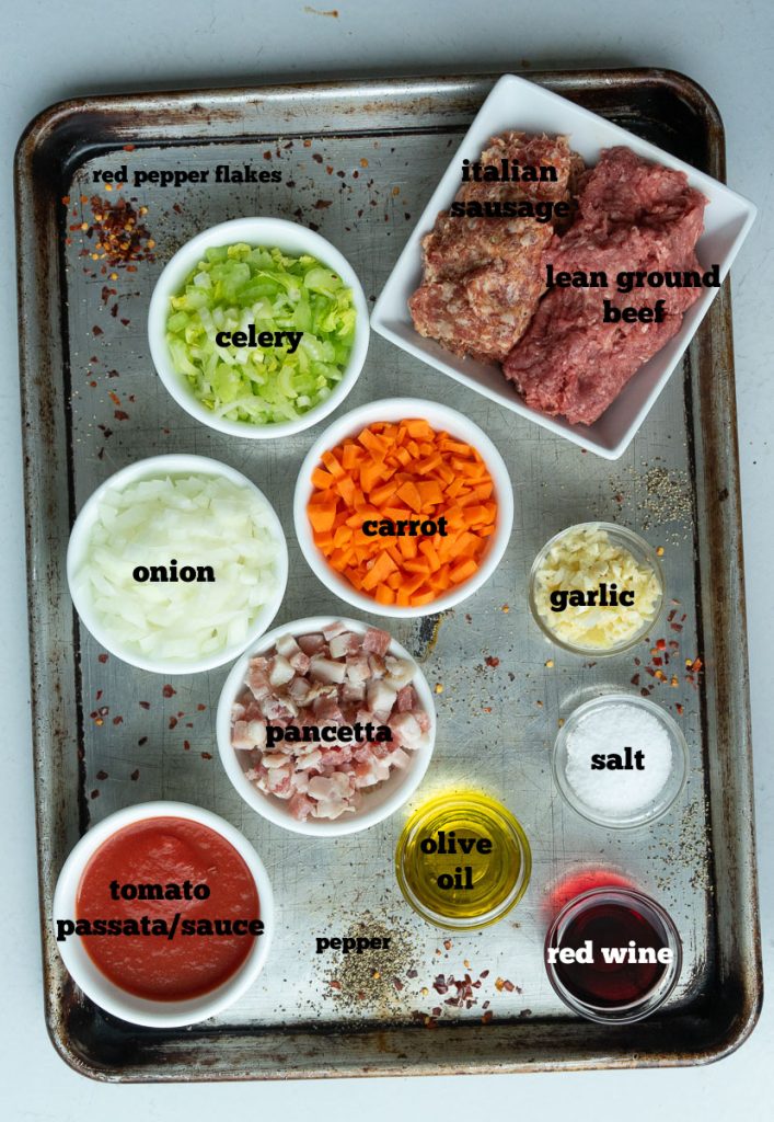 ingredients for ragu on a baking sheet