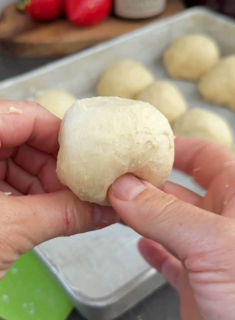 divide dough into 16 pieces and make balls for dinner rolls 