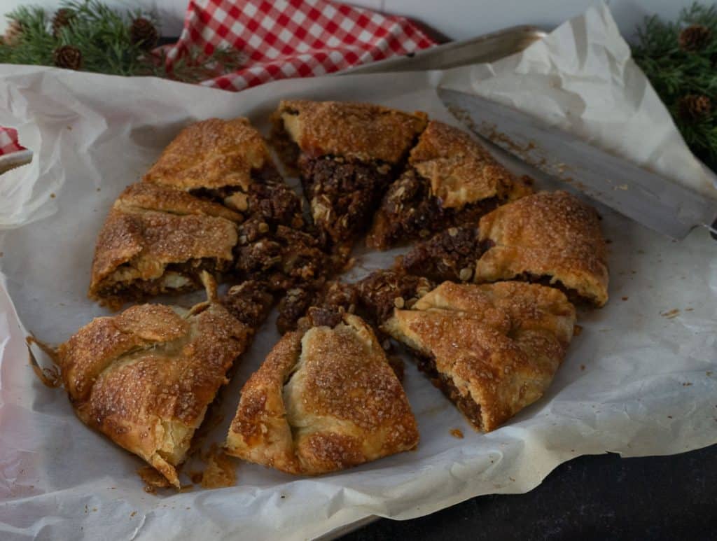 apple crisp galette cut into slices on baking sheet
