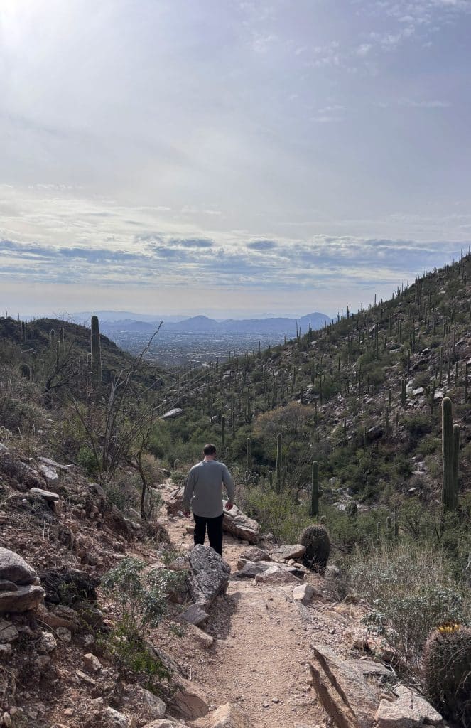 finger rock trail view of the valley below on the return hike, man walking in the distace