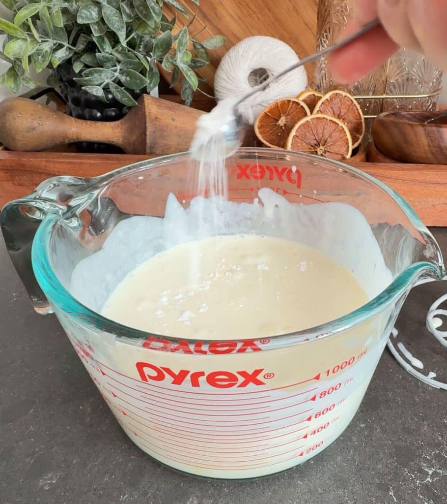 sprinkling baking soda over buttermilk and egg mixture