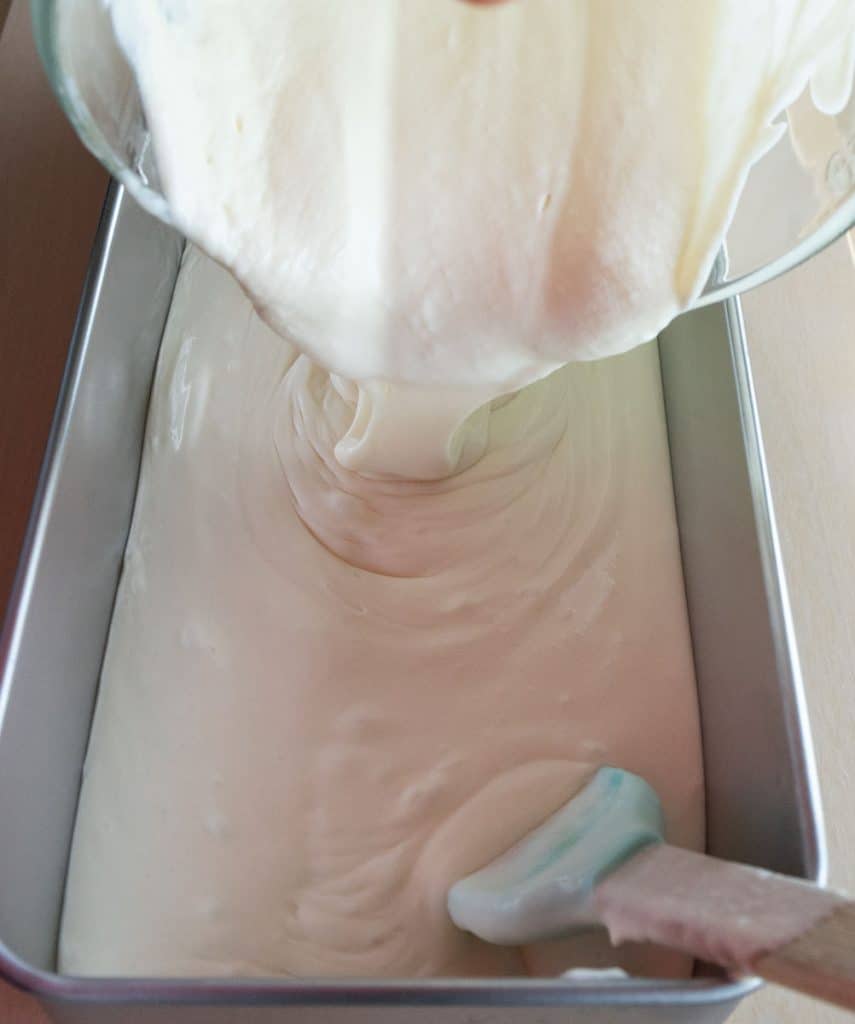 pouring ice cream batter in to long shallow pan 
