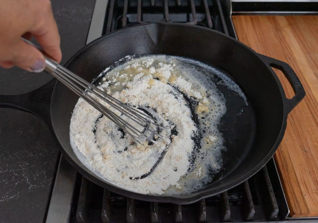 making roux in cast iron skillet on stove top