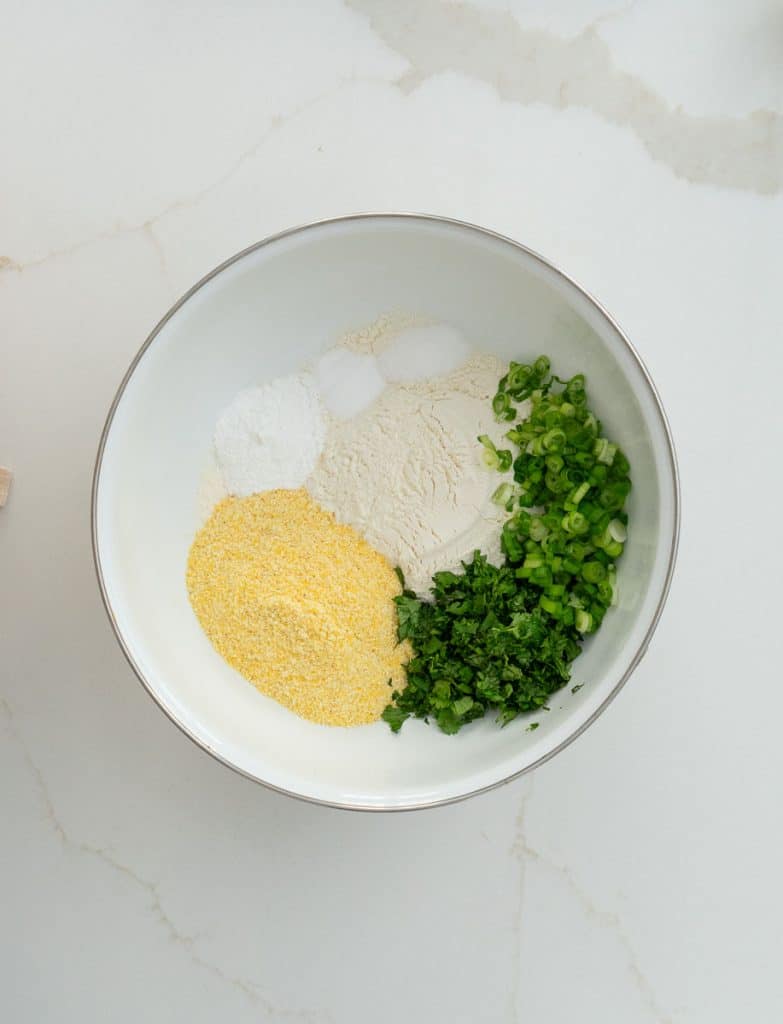 dumpling ingredients in a white mixing bowl