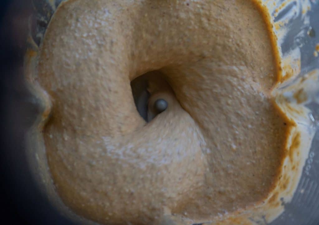 top view of pumpkin spice smoothie blending in the blender