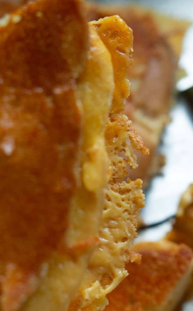 close up photo of the crispy parmesan and oozy cheese edges of the sheet pan parmesan crusted grilled cheese